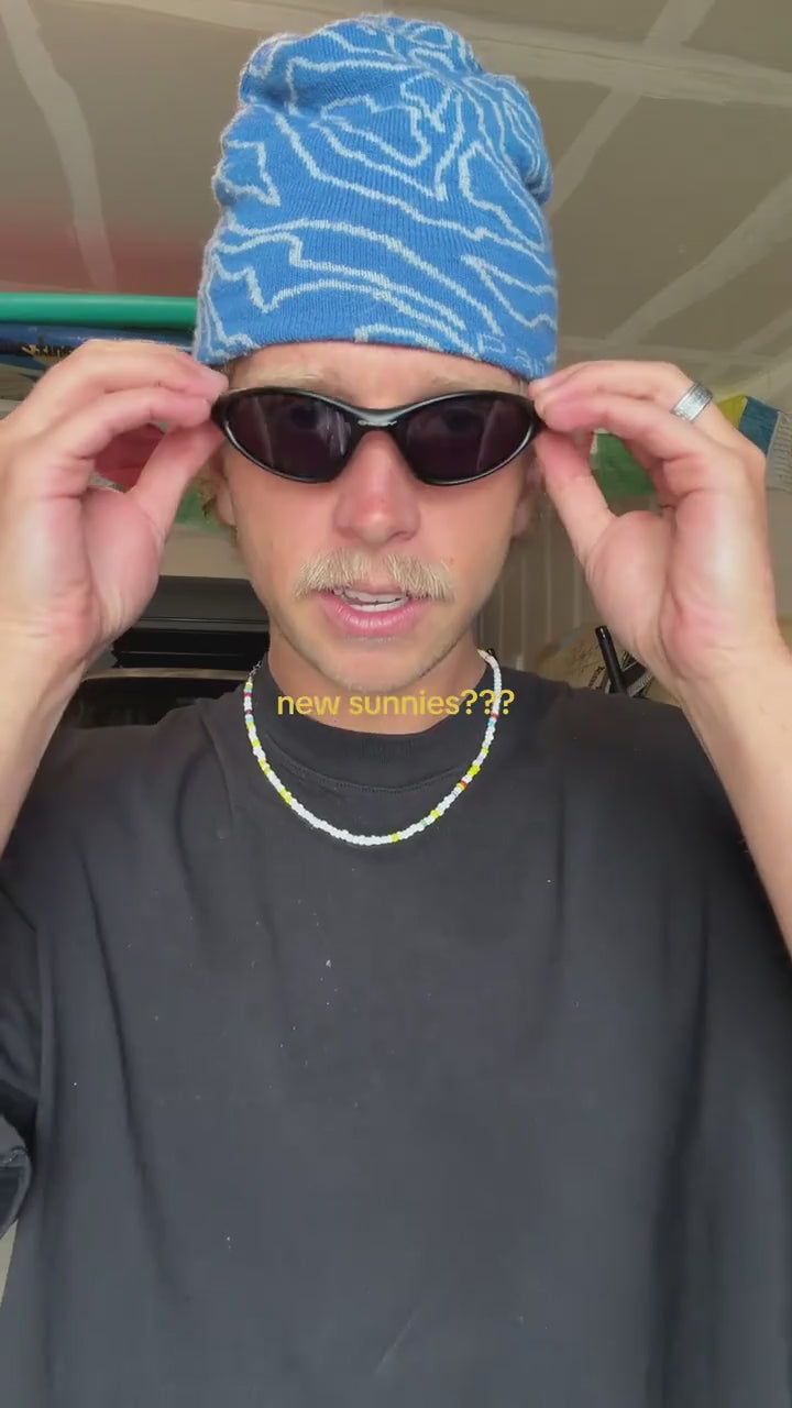 Video showing black Oakley Minute sunglasses being worn.