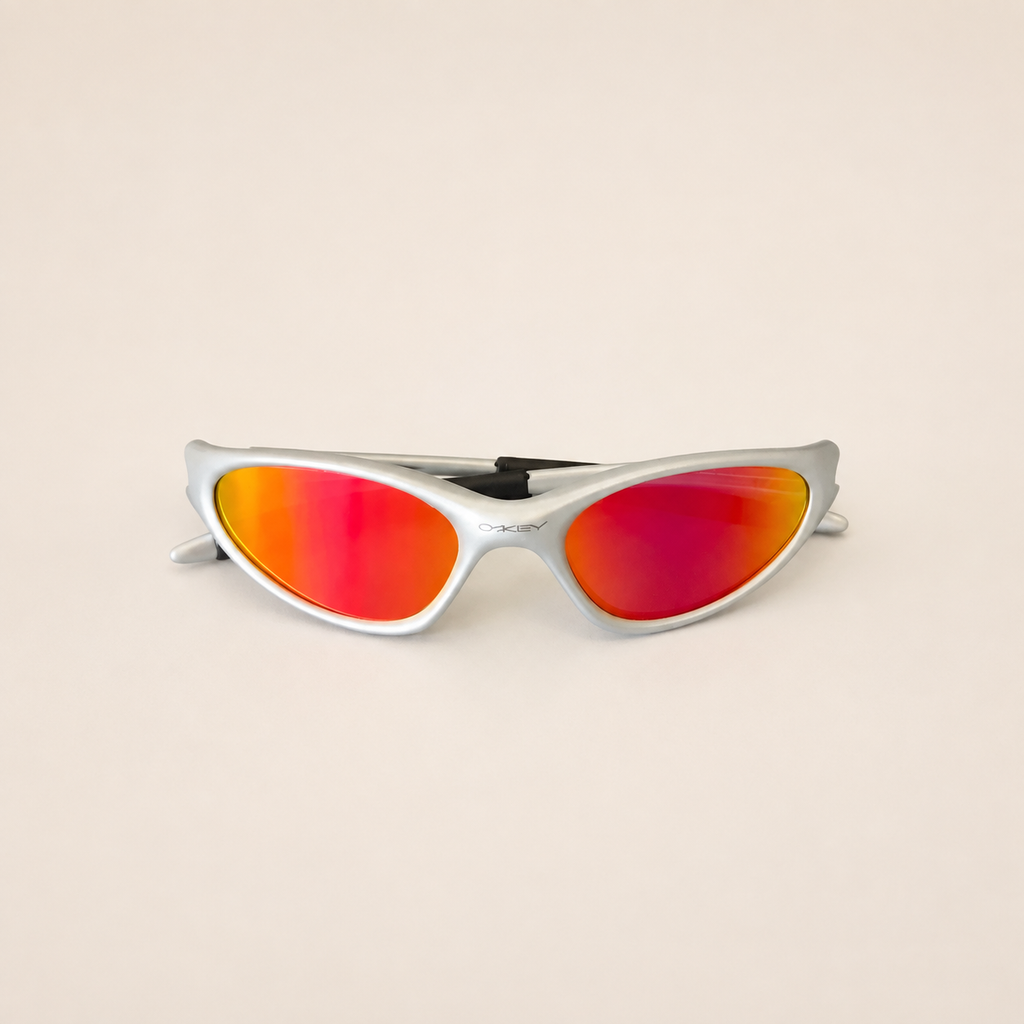 Front view of silver Oakley Minute sunglasses with red-orange mirrored lenses.